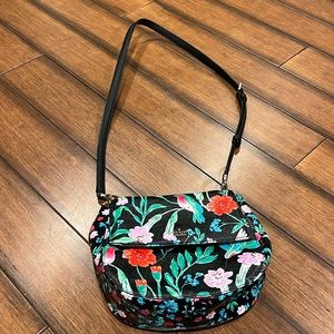 Funky floral scene leather bag.